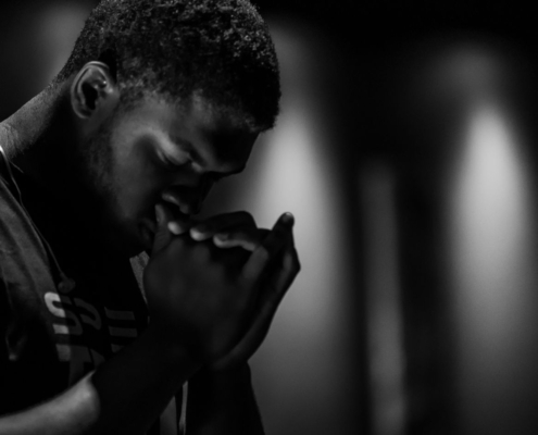 man praying;surrender to god