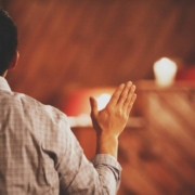 man praising church
